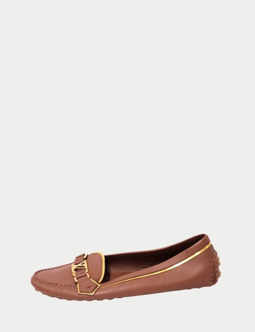 Louis Vuitton Brown Leather Loafers with gold LV hardware and stitched detailing