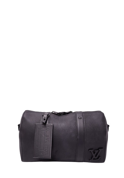 Louis Vuitton black grained leather Keepall-style bag with raised tonal LV logo, embossed luggage tag, vertical leather bands and black hardware