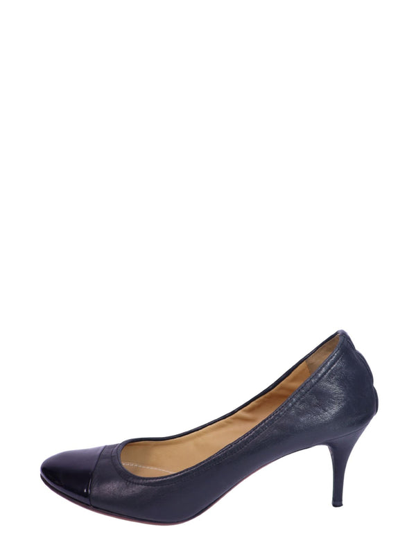 Lanvin black leather cap-toe kitten heels with a sleek silhouette and low heel