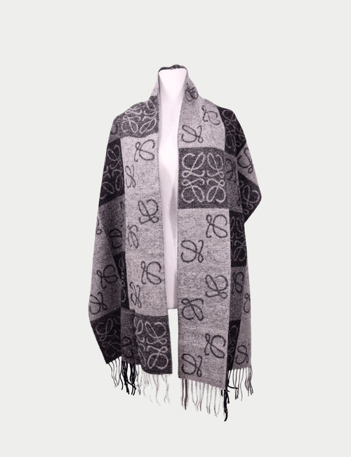 Givenchy black leather long wallet with embossed logo, flap closure, and contrast stitching