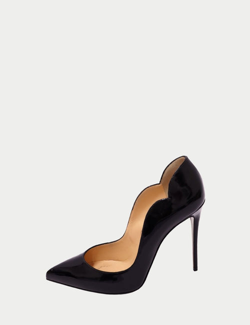 Christian Louboutin black patent leather pump with scalloped sides, pointed toe, and high stiletto heel