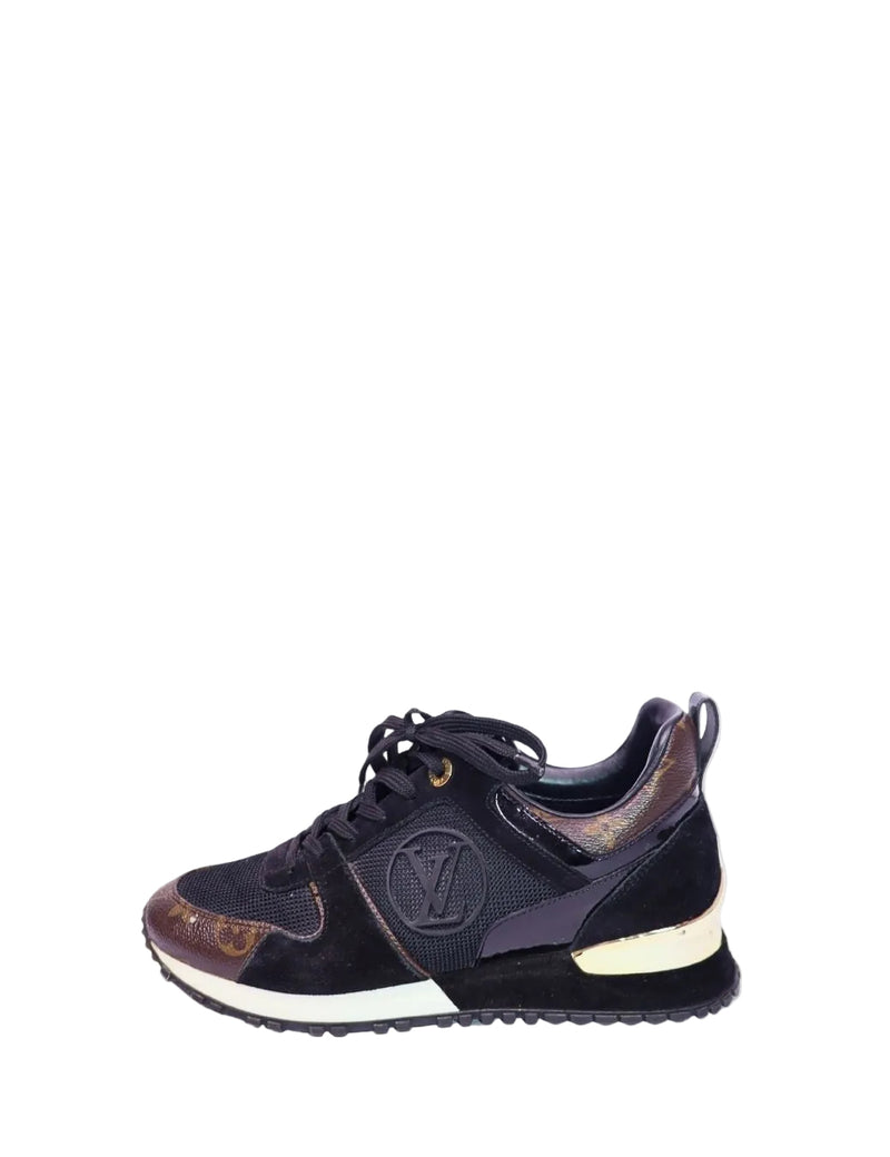 Black suede and mesh low-top sneakers by Louis Vuitton featuring signature monogram accents, LV side logo, lace-up closure, and contrast sole