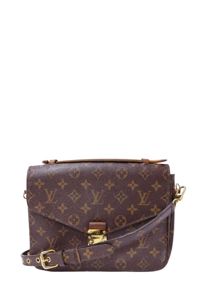 Christian Dior dark brown leather hobo bag with gold-tone CD hardware, leather-wrapped shoulder handle, and a soft slouchy silhouette
