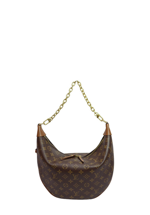 Louis Vuitton Loop shoulder bag in Monogram coated canvas with natural leather trim, gold-tone chain handle, and crescent-shaped silhouette.