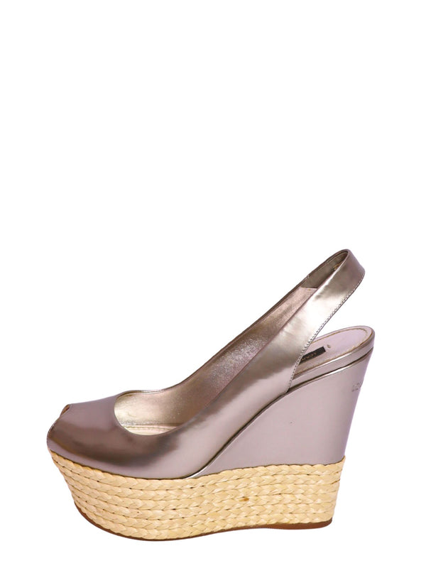 Authentic Louis Vuitton metallic champagne leather slingback wedge sandals with woven raffia platform, peep-toe design, and high wedge heel.