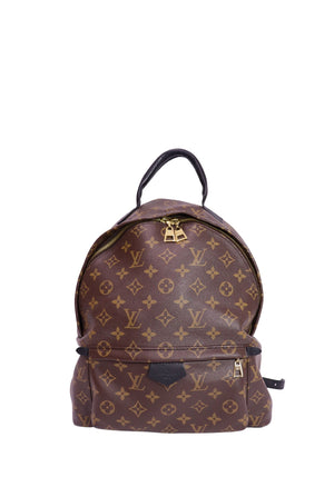 Authentic Louis Vuitton Palm Springs MM backpack in Monogram canvas with black leather trim, gold-tone hardware, front zip pocket, and adjustable shoulder straps.