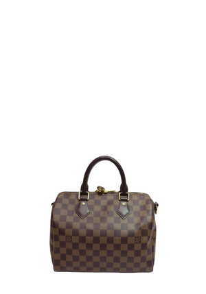 Louis Vuitton Speedy 25 handbag in Damier Ebene coated canvas featuring dual brown leather top handles, gold-tone hardware, and the iconic checkerboard pattern.