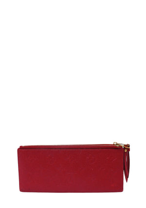 Authentic Louis Vuitton Adele Wallet in Cerise Monogram Empreinte embossed leather with gold-tone hardware.