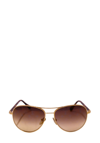 Authentic Louis Vuitton Conspiration pilot sunglasses with a gold-tone metal frame, tortoiseshell temples, and brown gradient lenses.