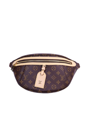 Louis Vuitton Monogram Bumbag in brown Monogram canvas with Vachetta leather trim, front zip pocket, and LV luggage tag detail
