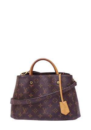 Louis Vuitton Montaigne BB handbag in Monogram coated canvas with Vachetta leather top handles, removable shoulder strap, and gold-tone hardware.