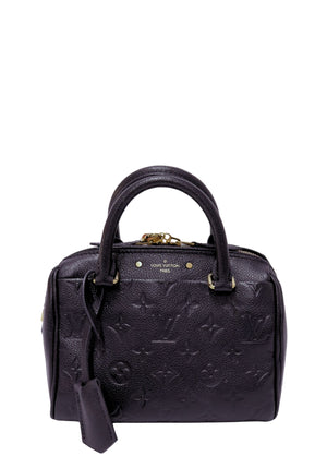 Louis Vuitton black Monogram Empreinte leather Speedy Bandoulière handbag featuring embossed Monogram pattern, rolled top handles, gold-tone hardware, top zip closure, removable leather clochette, and a structured silhouette