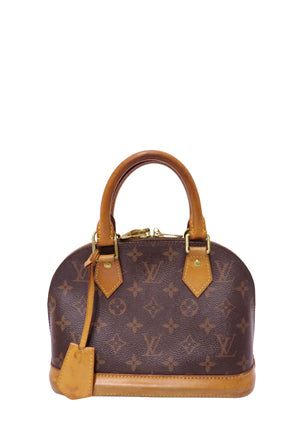 Louis Vuitton Alma BB handbag in Monogram coated canvas with natural Vachetta leather trim, dual rolled handles, and gold-tone hardware.