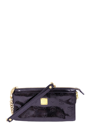 Authentic MCM black patent leather small shoulder bag with embossed Visetos monogram, gold-tone logo plaque, zip-top closure, detachable shoulder strap, and chain detail