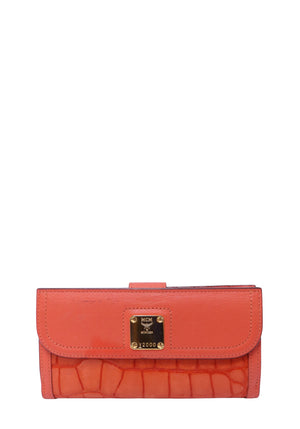 Authentic MCM orange croc-embossed leather continental wallet featuring a gold-tone logo plaque, flap closure, and slim silhouette