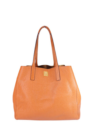 MCM camel brown pebbled leather tote bag with gold-tone logo hardware and double shoulder straps.