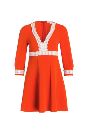 Maje Ricoeur orange stretch-crepe dress with white lace trim, V-neckline, three-quarter sleeves, and fit-and-flare silhouette