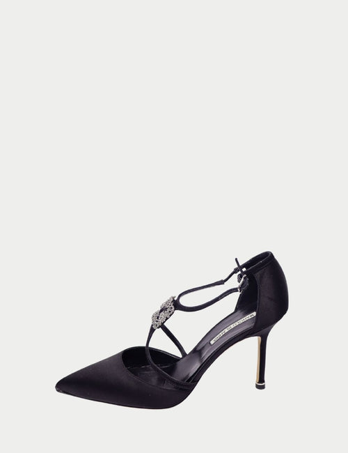 Black satin pointed-toe heels by Manolo Blahnik featuring T-strap design with crystal embellishment and slim stiletto heel