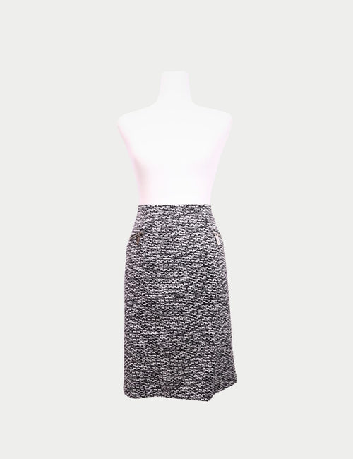 Close-up of Michael Kors textured fabric skirt with zip pockets