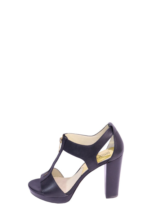 Michael Kors black leather platform sandals with front zip closure, open toe, cutout design, and block heel.