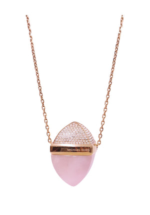 Authentic Michael Kors gold-tone necklace featuring a rose quartz pendant with crystal pavé detailing.