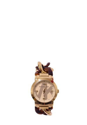 Authentic Michael Kors gold-tone bracelet watch with tortoiseshell acetate links and a champagne analog dial.