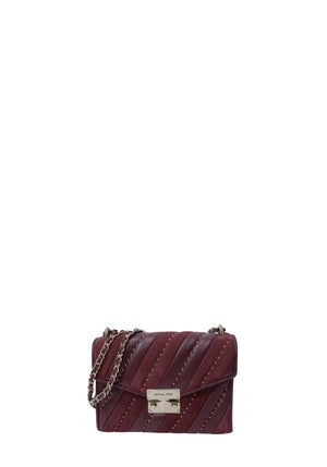 Michael Kors burgundy leather and suede shoulder bag with gold-tone studs, chain strap, and front lock closure
