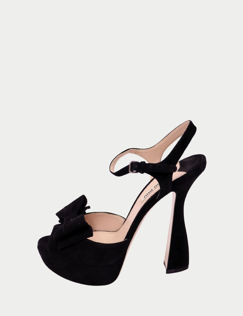 Black Miu Miu suede platform heels with bow detail and ankle strap