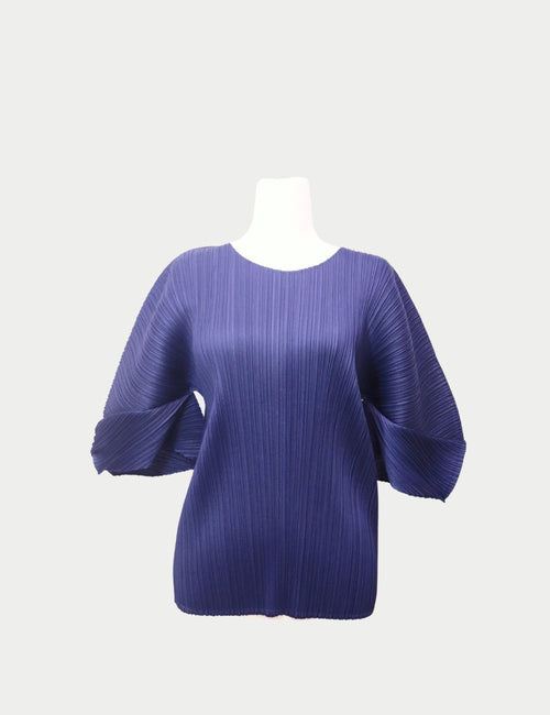 Pleats Please Issey Miyake navy blue pleated top with wide sculptural sleeves and round neckline