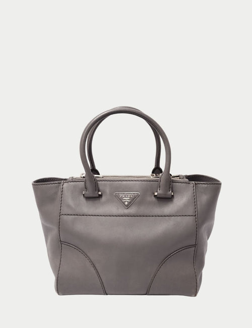 Prada grey leather handbag with silver triangle logo plaque and top handles