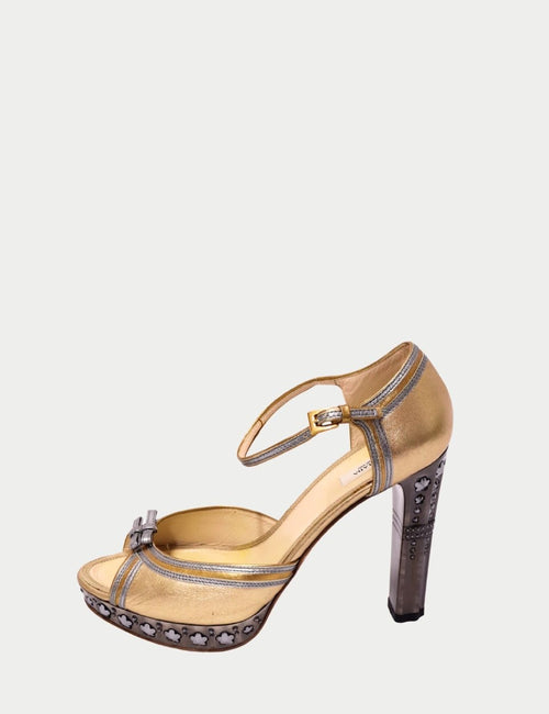Prada designer heels with sculptural metallic heel detail
