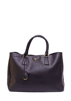 Prada Saffiano Lux black leather tote bag with gold-tone hardware and triangle logo