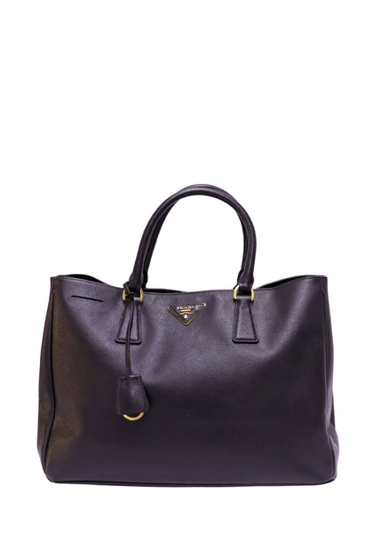 Prada Saffiano Lux black leather tote bag with gold-tone hardware and triangle logo