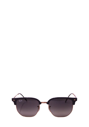 Ray-Ban black Clubmaster-style sunglasses with gold-tone metal temples and grey tinted lenses on a white background.