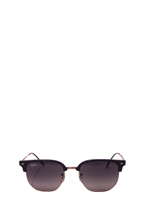 Ray-Ban black Clubmaster-style sunglasses with gold-tone metal temples and grey tinted lenses on a white background.