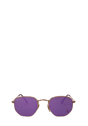Ray-Ban gold metal hexagonal sunglasses with purple lenses displayed on a white background.