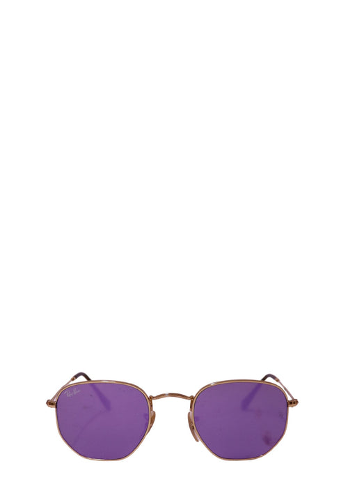 Ray-Ban gold metal hexagonal sunglasses with purple lenses displayed on a white background.