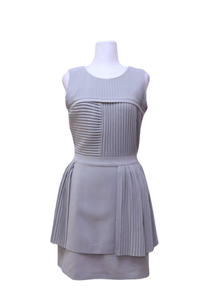 Authentic Reiss light grey sleeveless mini dress featuring pleated panel detailing, a round neckline, defined waist, and layered skirt