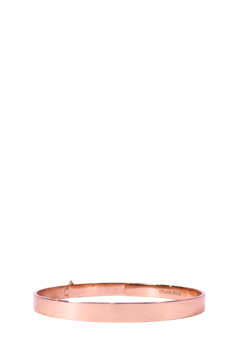 Eddie Borgo rose gold tone minimalist choker necklace with polished metallic finish.