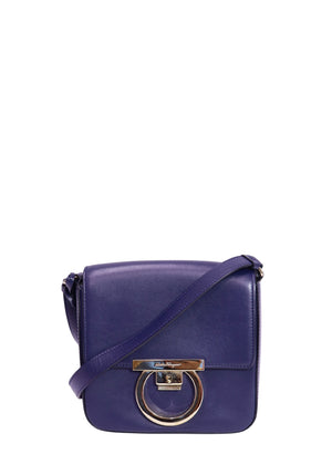 Authentic Salvatore Ferragamo Gancini small navy leather crossbody bag with gold-tone Gancini clasp and adjustable leather shoulder strap.
