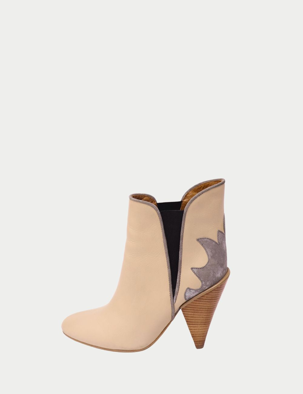 Step into contemporary chic with these See by Chloé ankle boots, crafted from smooth beige leather with distinctive contrast suede panels and elastic side inserts. Featuring a pointed toe and a sculpted wooden block heel, these boots offer both comfort an