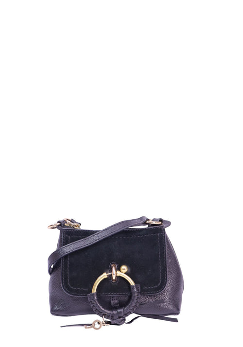 See by Chloé Mini Joan navy leather and suede crossbody bag featuring gold-tone ring hardware, braided leather detail, key charm, and shoulder strap
