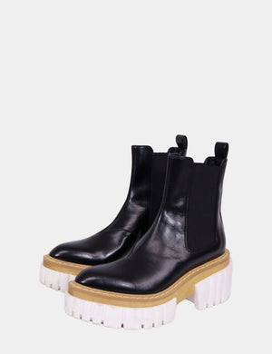 Stella McCartney black vegan leather Chelsea boots with chunky white platform sole

