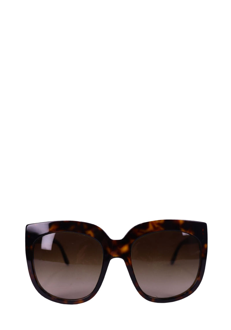 Stella McCartney oversized tortoiseshell sunglasses with gradient brown lenses and square frame design.