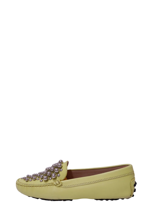 Authentic Tod's yellow leather Gommino driving loafers featuring silver stud embellishments and the signature rubber pebble sole.