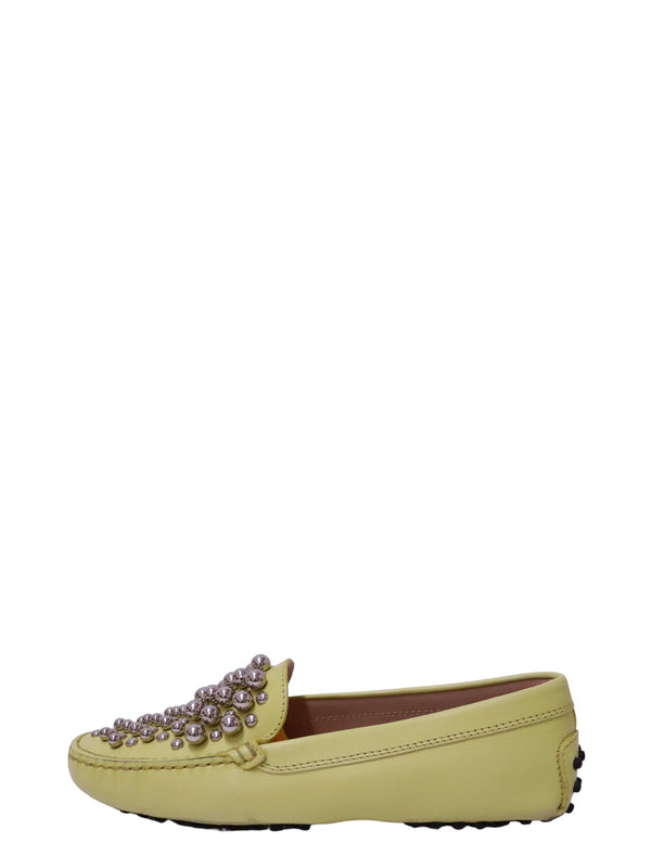 Authentic Tod's yellow leather Gommino driving loafers featuring silver stud embellishments and the signature rubber pebble sole.