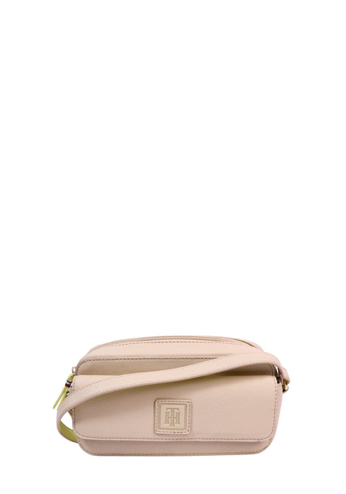 Tommy Hilfiger beige camera crossbody bag with textured faux leather, gold-tone hardware, signature TH logo plaque, and adjustable shoulder strap with neon yellow detailing