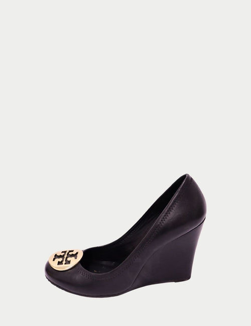 Tory Burch black wedge shoes with signature gold emblem