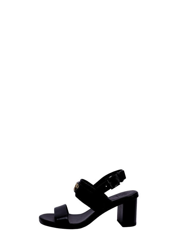 Tory Burch black leather sandals featuring a block heel, adjustable ankle strap, and minimalist open-toe design