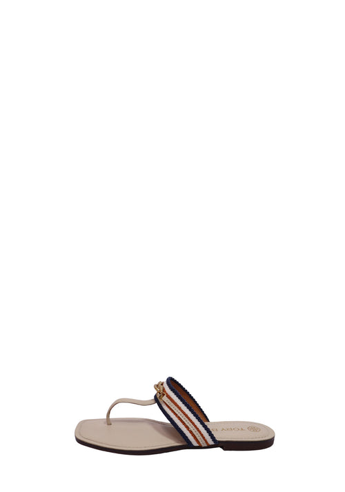 Tory Burch flat thong sandals with orange and navy striped woven straps and gold-tone chain detail on a cream leather footbed.
